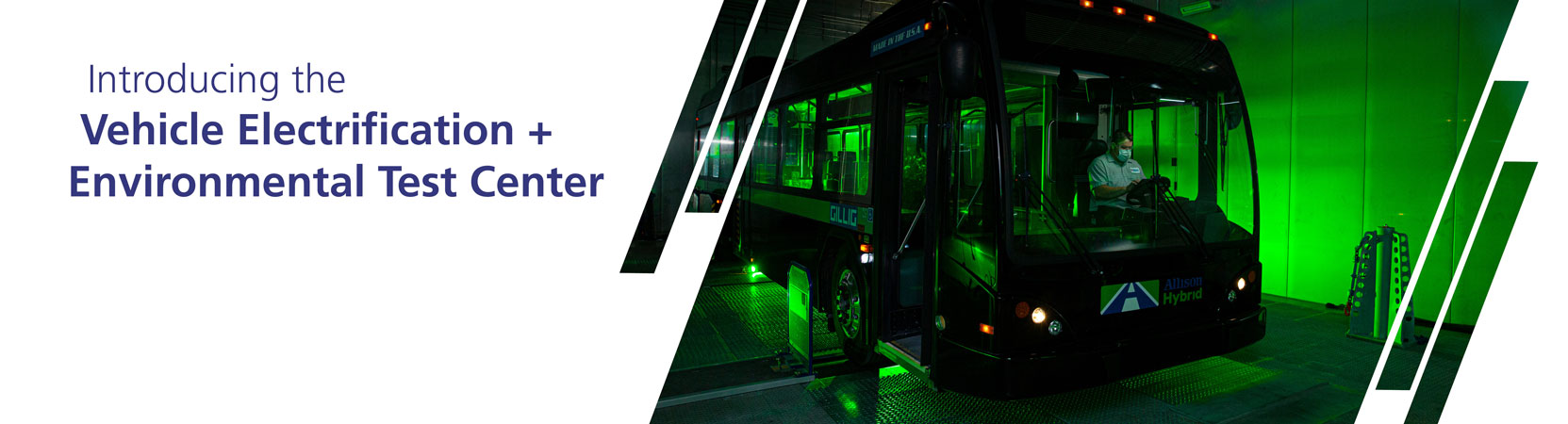 A black bus is shown on a dyne with green lights all around it. Text reads "Introducing Vehicle Electrification + Environmental Test Center"